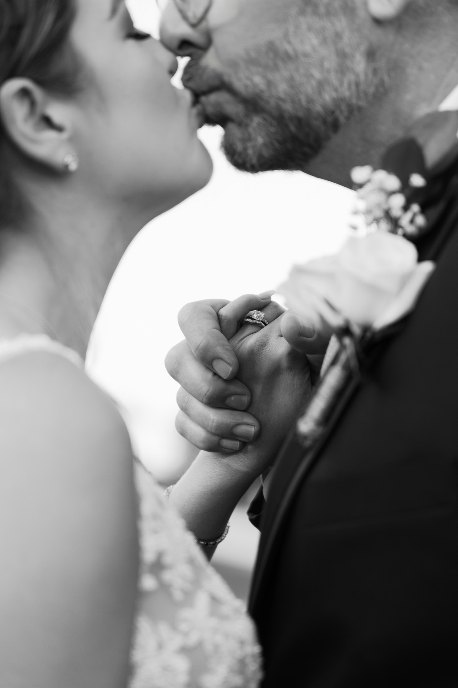 A cinematic embrace at sunset in black and white