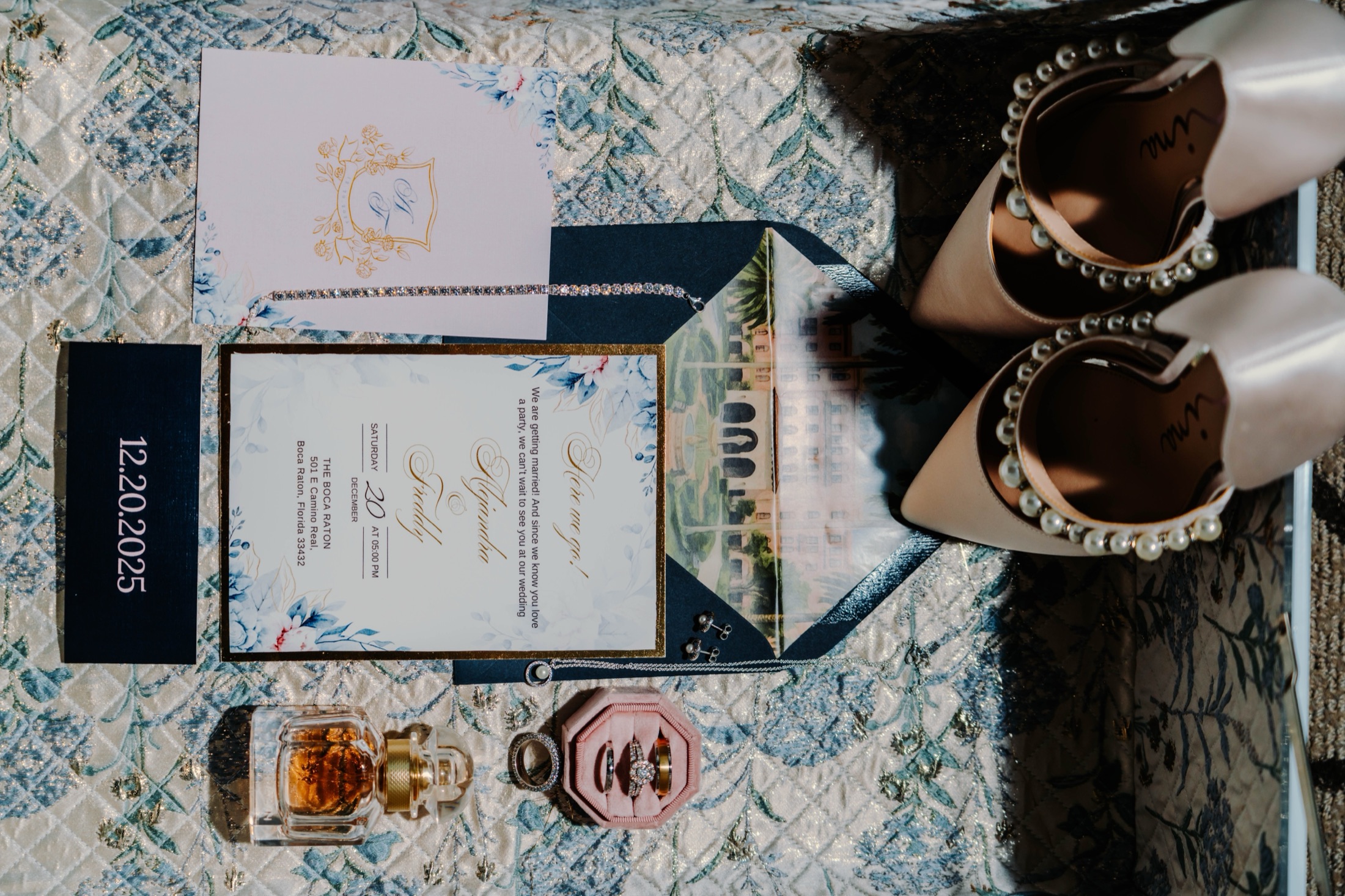 Wedding heirlooms styled at The Boca Raton: the invitation suite, pearl heels, rings, and perfume, photographed by GM Productions