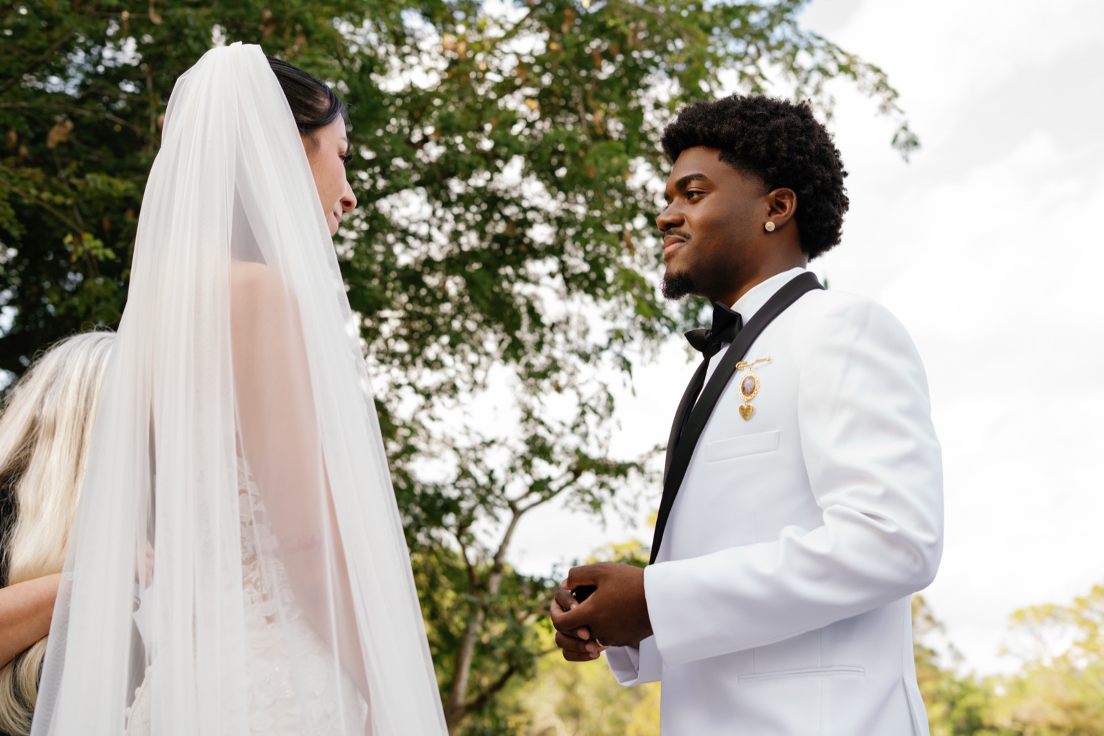 The lakeside ceremony, veil flowing