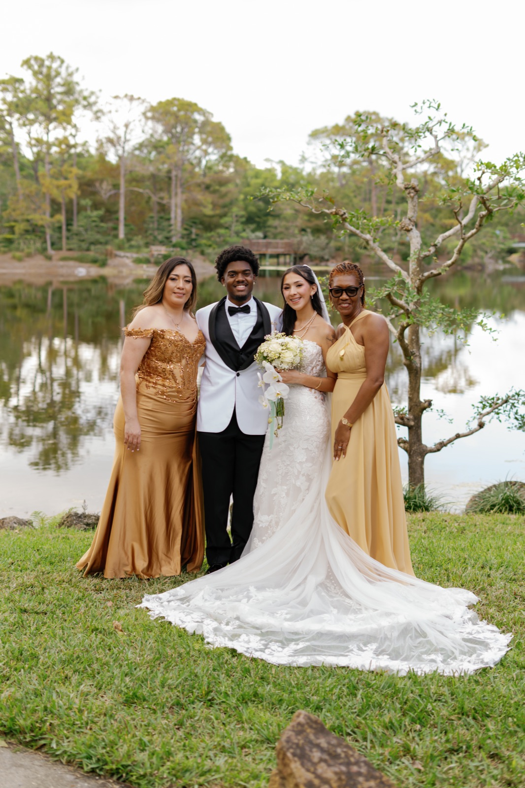 The bride with her bridal party by the lake