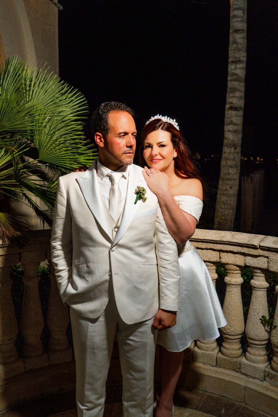 Nighttime couple portrait on the estate balcony